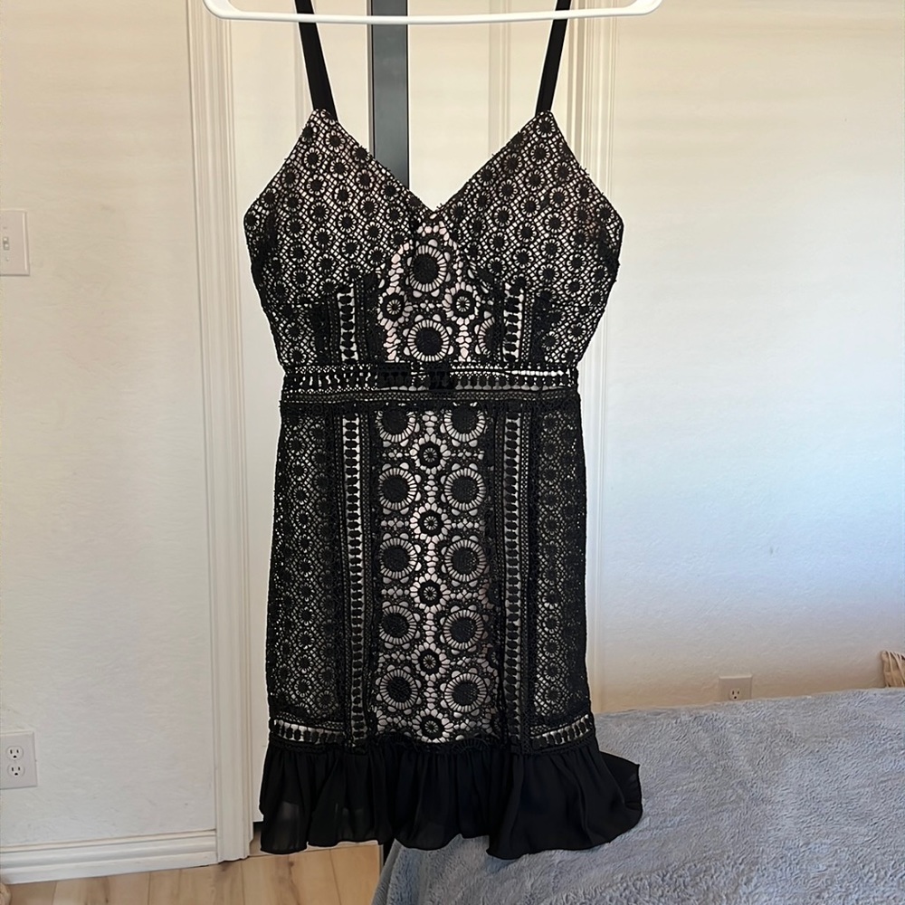 Size small, black, mini dress, lace detail with opening around waist band